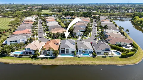 a bedroom with two beds and a chandelier