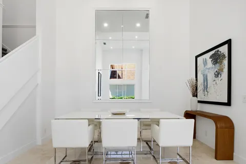 a view of a livingroom with workspace and a couch