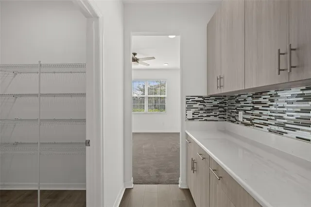 a view of a kitchen cabinets and window