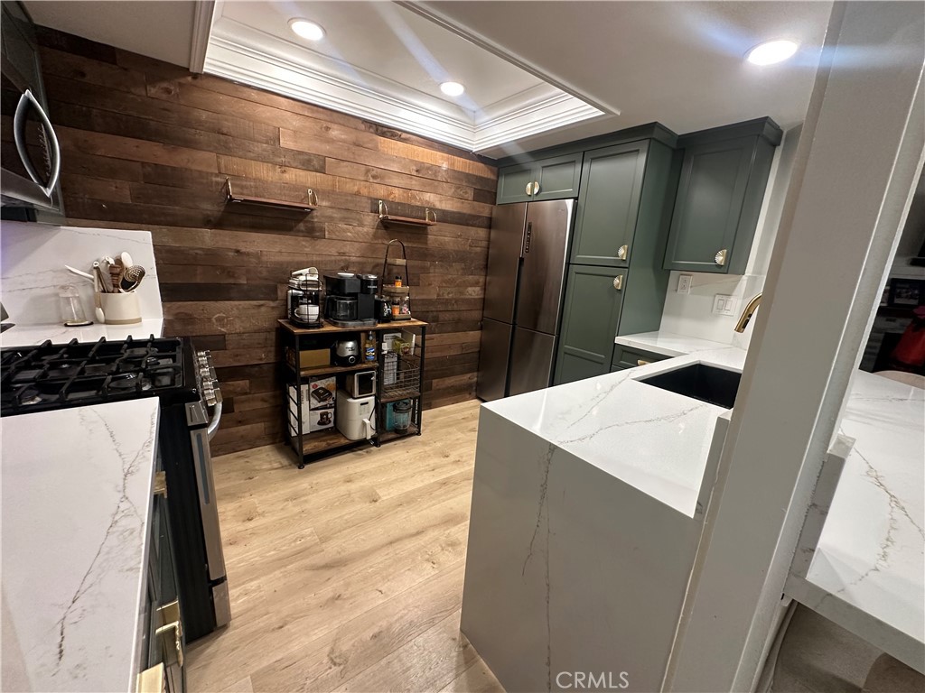 18223 Soledad Canyon Road, Unit 45 Canyon Country, CA 91387 - Photo 15 of 24 a kitchen with stainless steel appliances a refrigerator and a stove