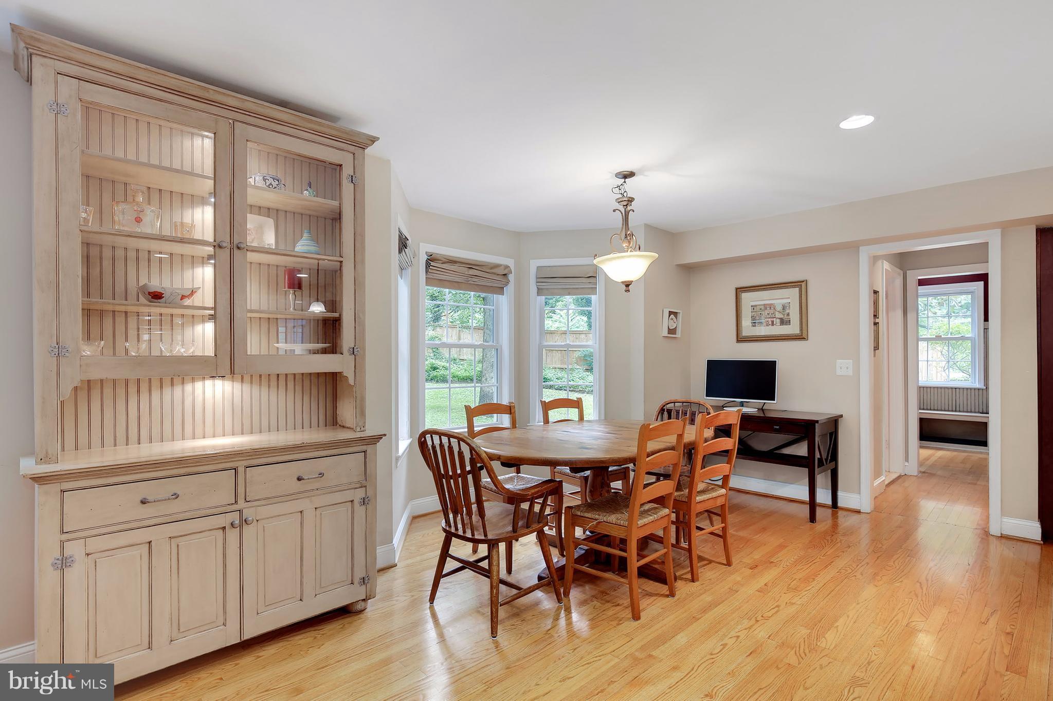 7913 Piney Branch Road Silver Spring, MD 20910 - Photo 11 of 30 a view of a dining room with furniture window and wooden floor