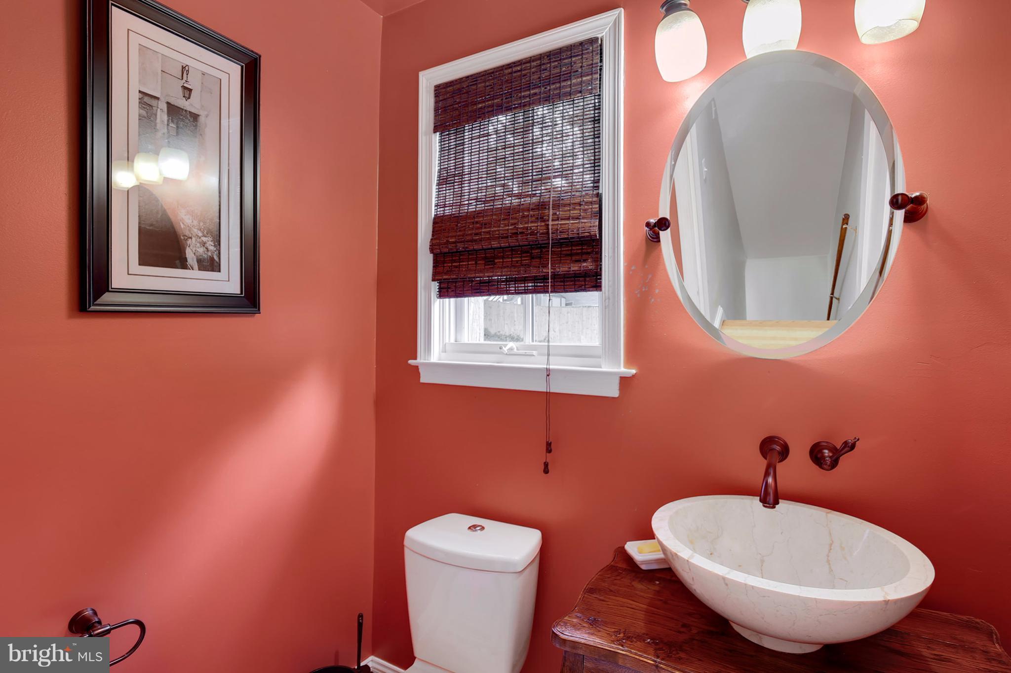7913 Piney Branch Road Silver Spring, MD 20910 - Photo 13 of 30 a bathroom with a toilet and a sink