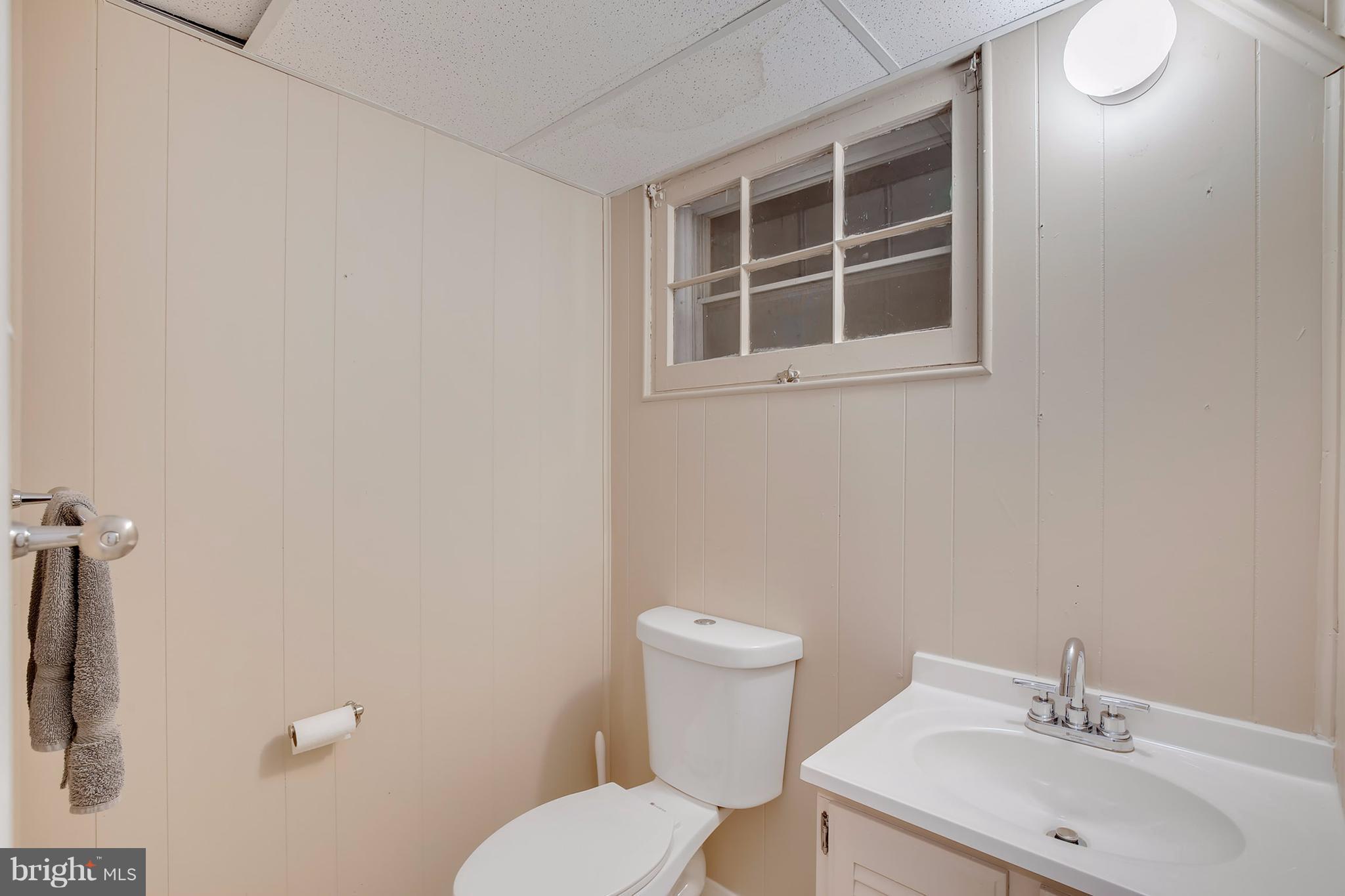 7913 Piney Branch Road Silver Spring, MD 20910 - Photo 18 of 30 a bathroom with a sink mirror and toilet