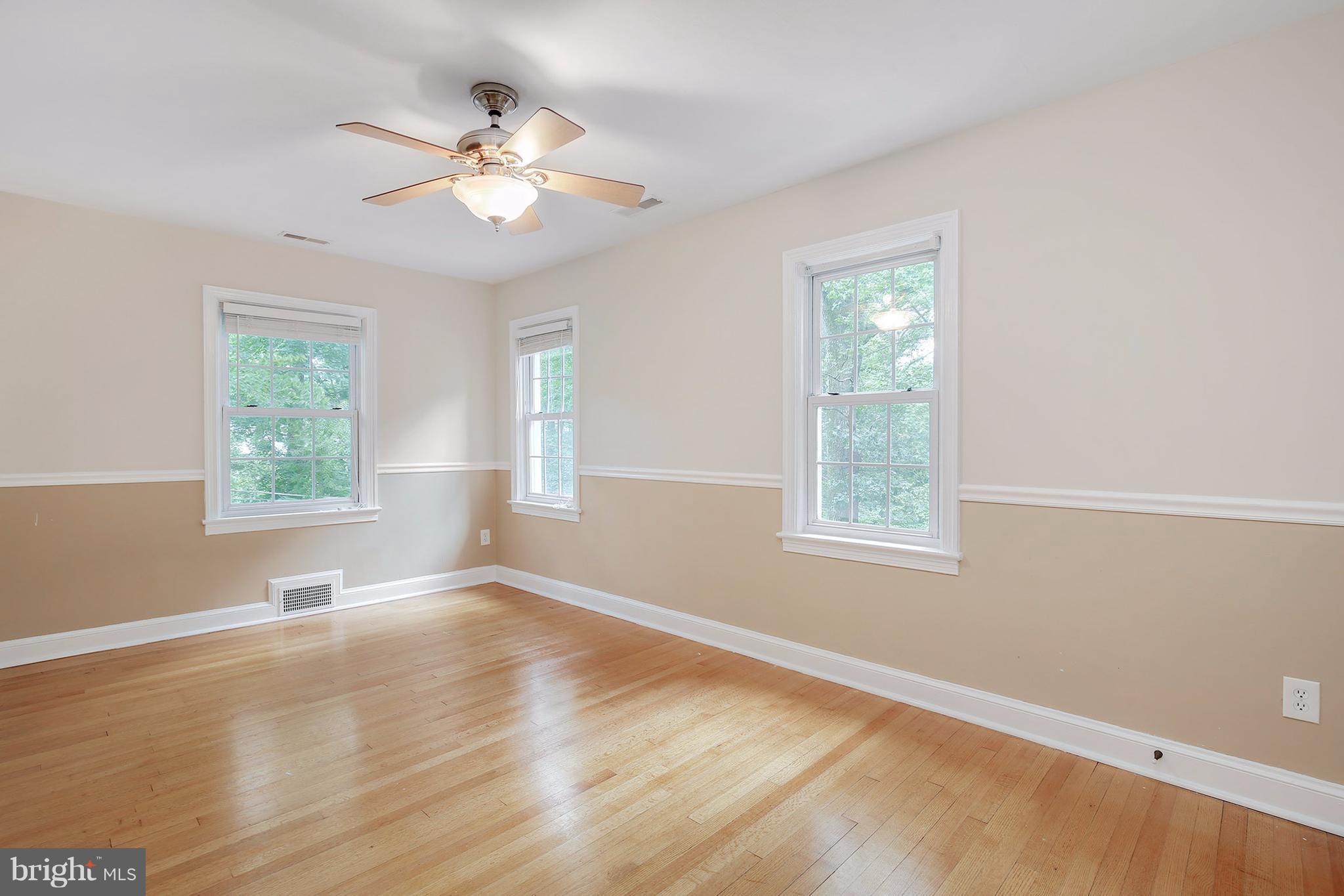 7913 Piney Branch Road Silver Spring, MD 20910 - Photo 20 of 30 wooden floor in an empty room with a window