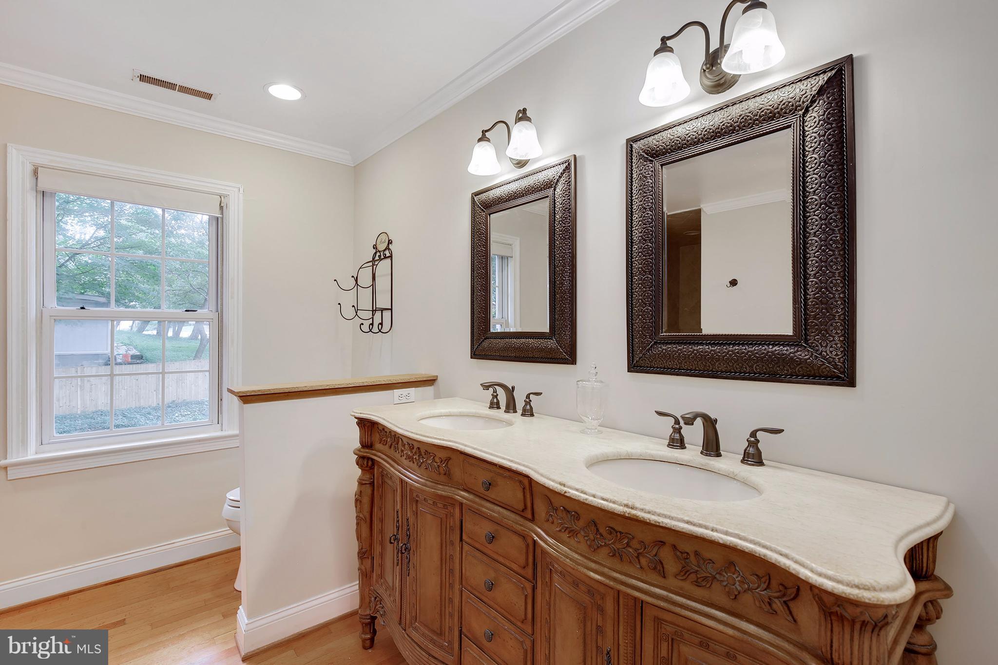 7913 Piney Branch Road Silver Spring, MD 20910 - Photo 21 of 30 a bathroom with a sink double vanity and a mirror