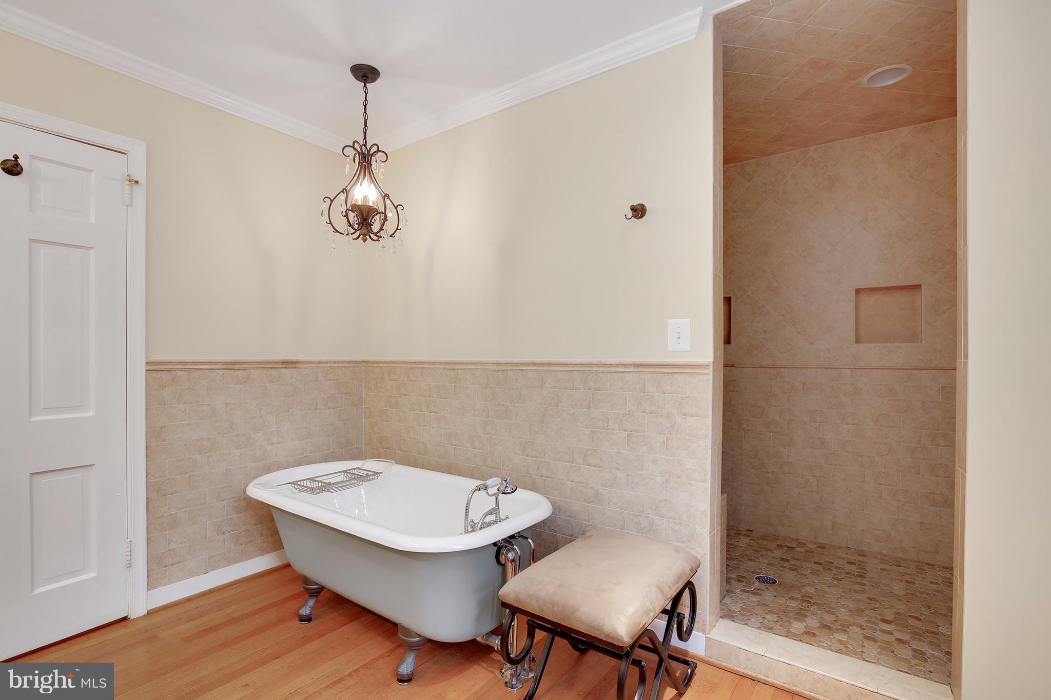 7913 Piney Branch Road Silver Spring, MD 20910 - Photo 22 of 30 a bathroom with a sink a toilet and a mirror