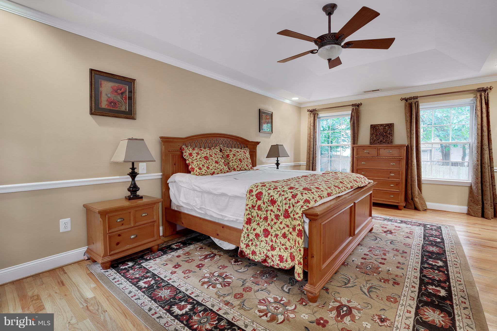 7913 Piney Branch Road Silver Spring, MD 20910 - Photo 23 of 30 a bedroom with a bed rug and wooden floor