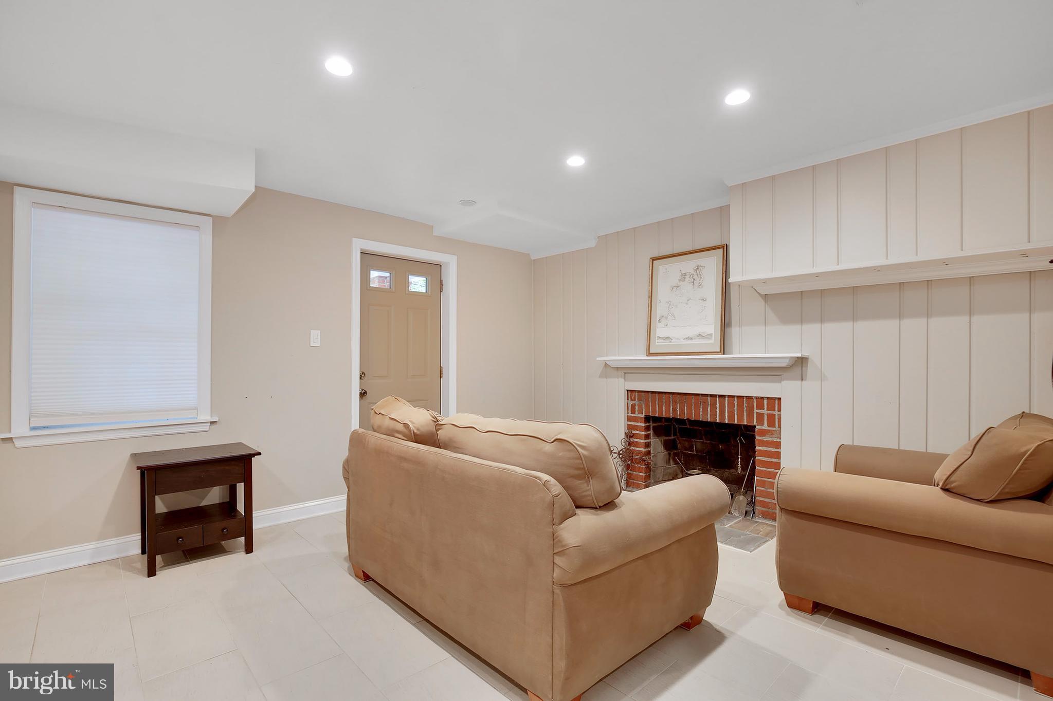 7913 Piney Branch Road Silver Spring, MD 20910 - Photo 27 of 30 a living room with furniture and a fireplace