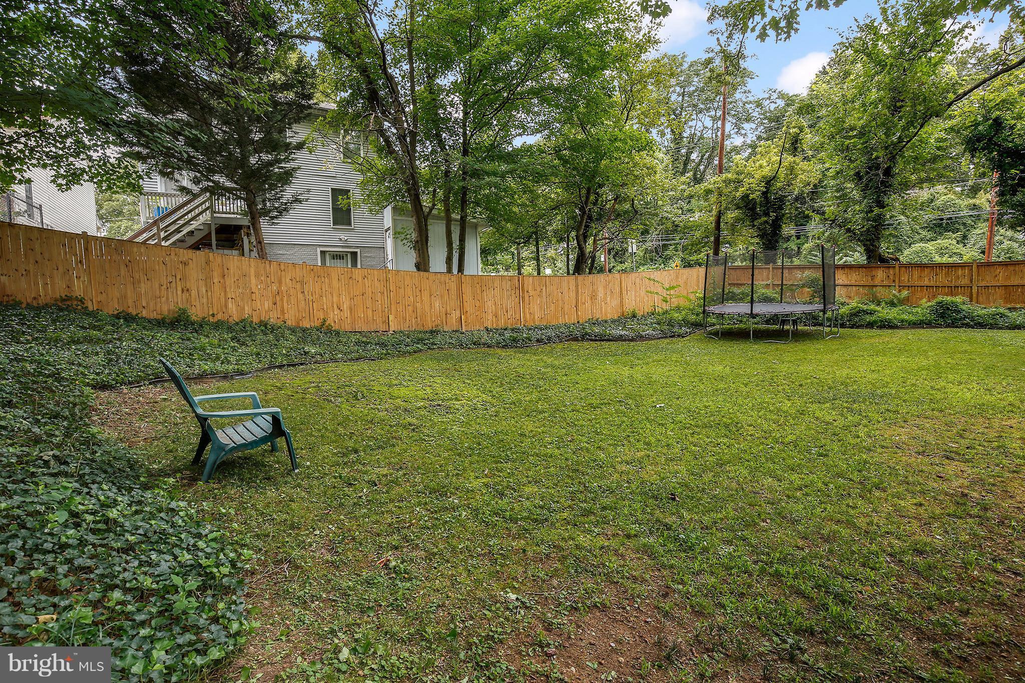 7913 Piney Branch Road Silver Spring, MD 20910 - Photo 29 of 30 a view of a backyard with a garden and trees
