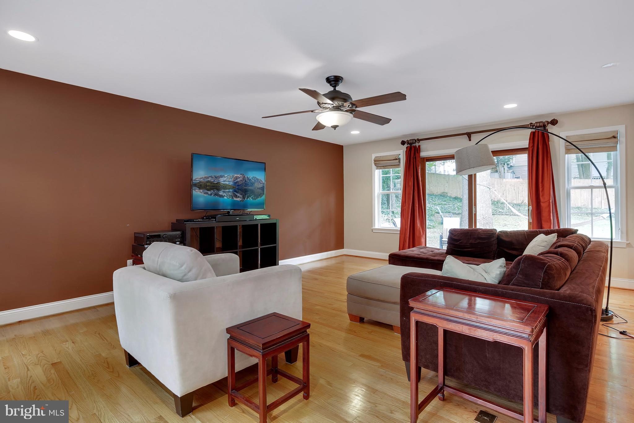 7913 Piney Branch Road Silver Spring, MD 20910 - Photo 4 of 30 a living room with furniture a window and a flat screen tv