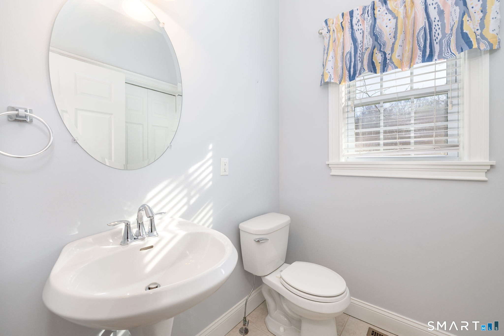 66 Kristyn Circle, Unit 66 Manchester, CT 06042 - Photo 11 of 26 a bathroom with a sink a mirror and a toilet