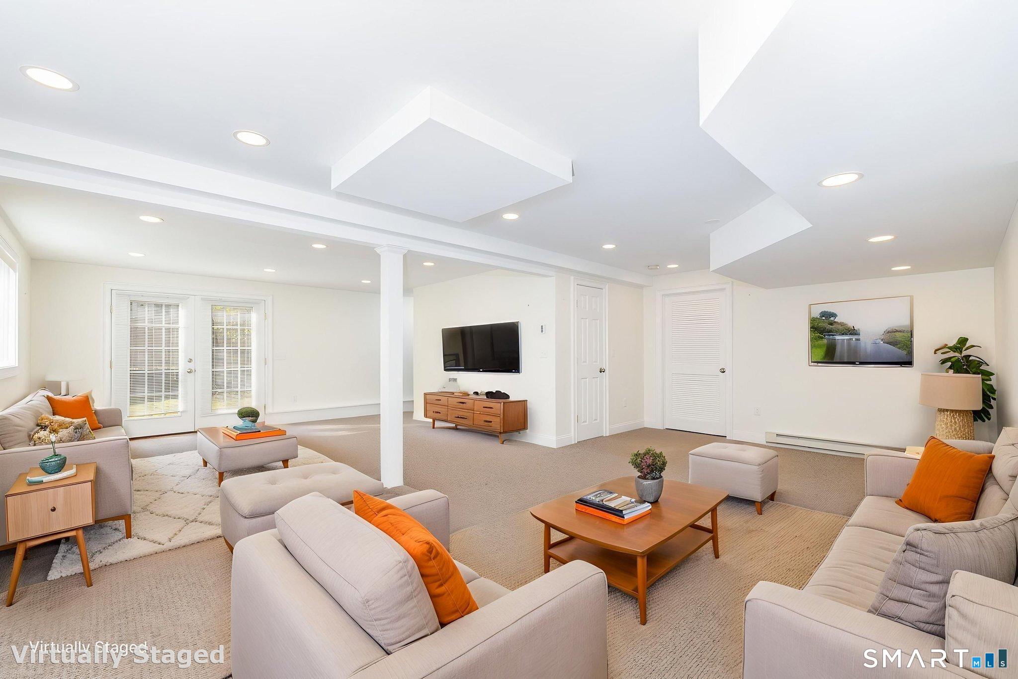 66 Kristyn Circle, Unit 66 Manchester, CT 06042 - Photo 20 of 26 a living room with furniture and a flat screen tv
