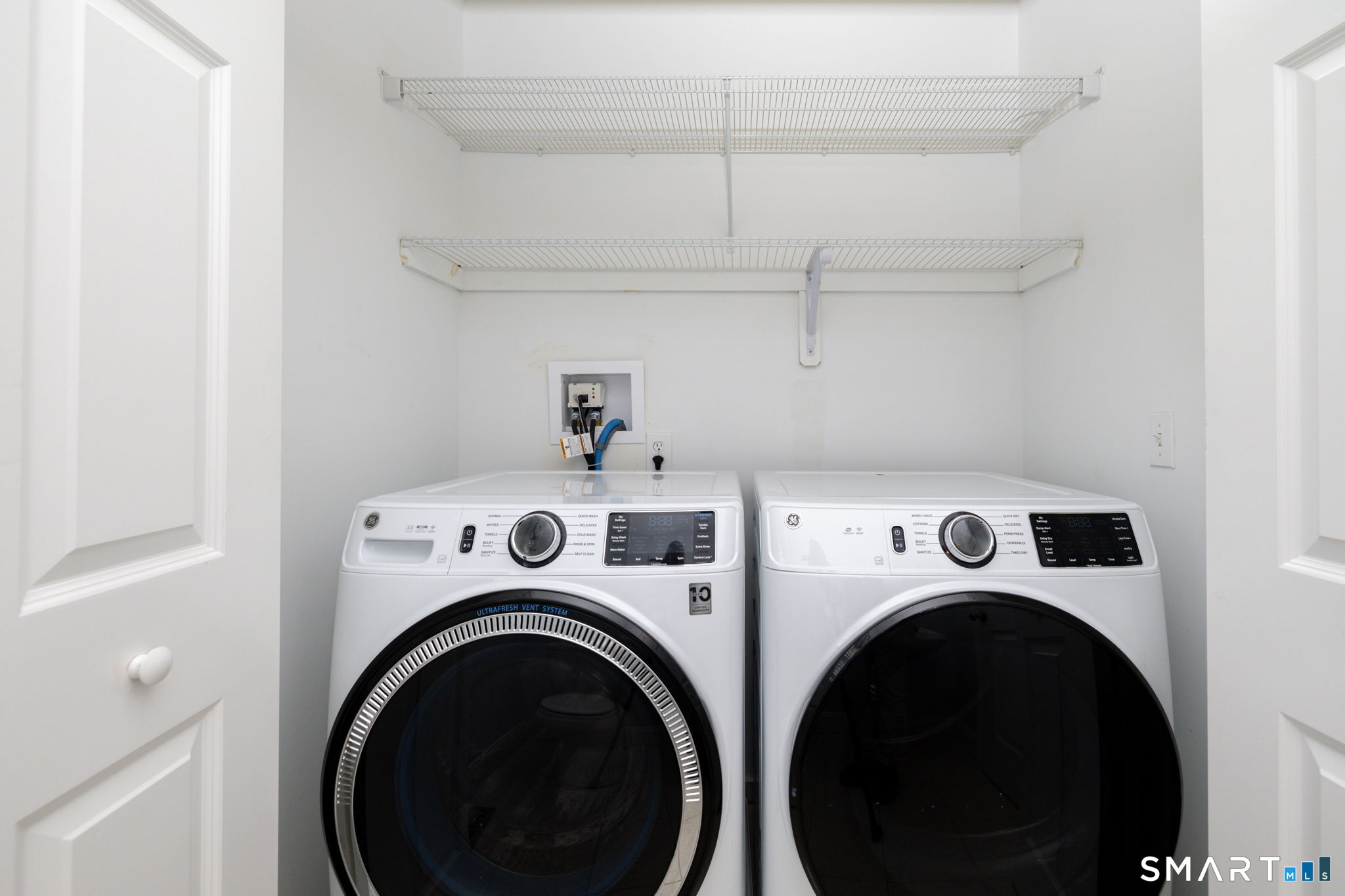 66 Kristyn Circle, Unit 66 Manchester, CT 06042 - Photo 22 of 26 a utility room with dryer and washer