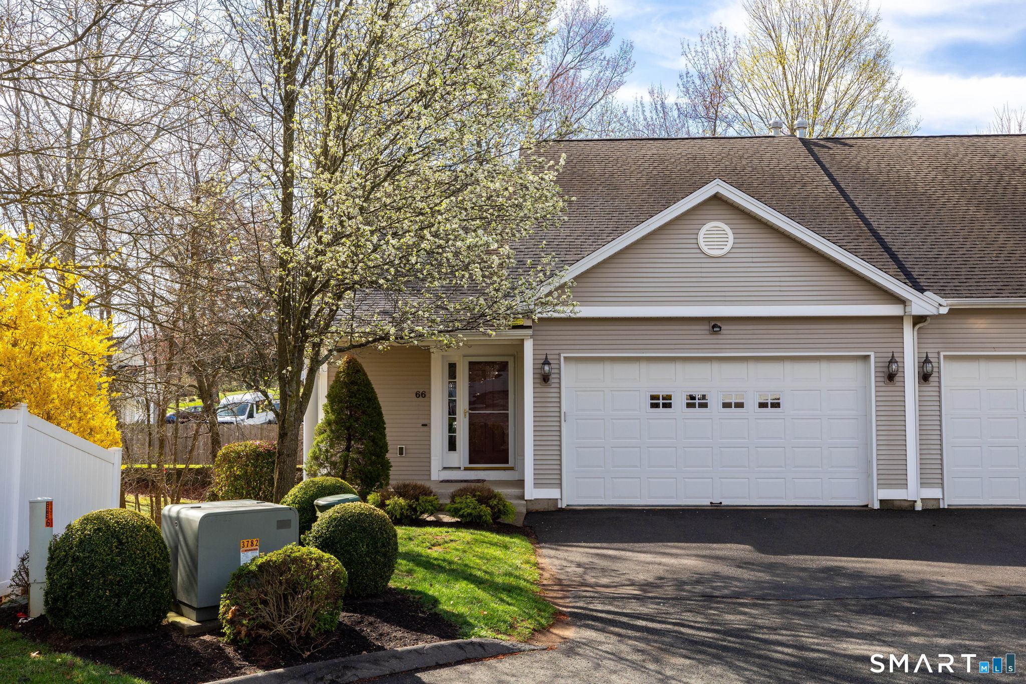 66 Kristyn Circle, Unit 66 Manchester, CT 06042 - Photo 24 of 26 a front view of a house with garden