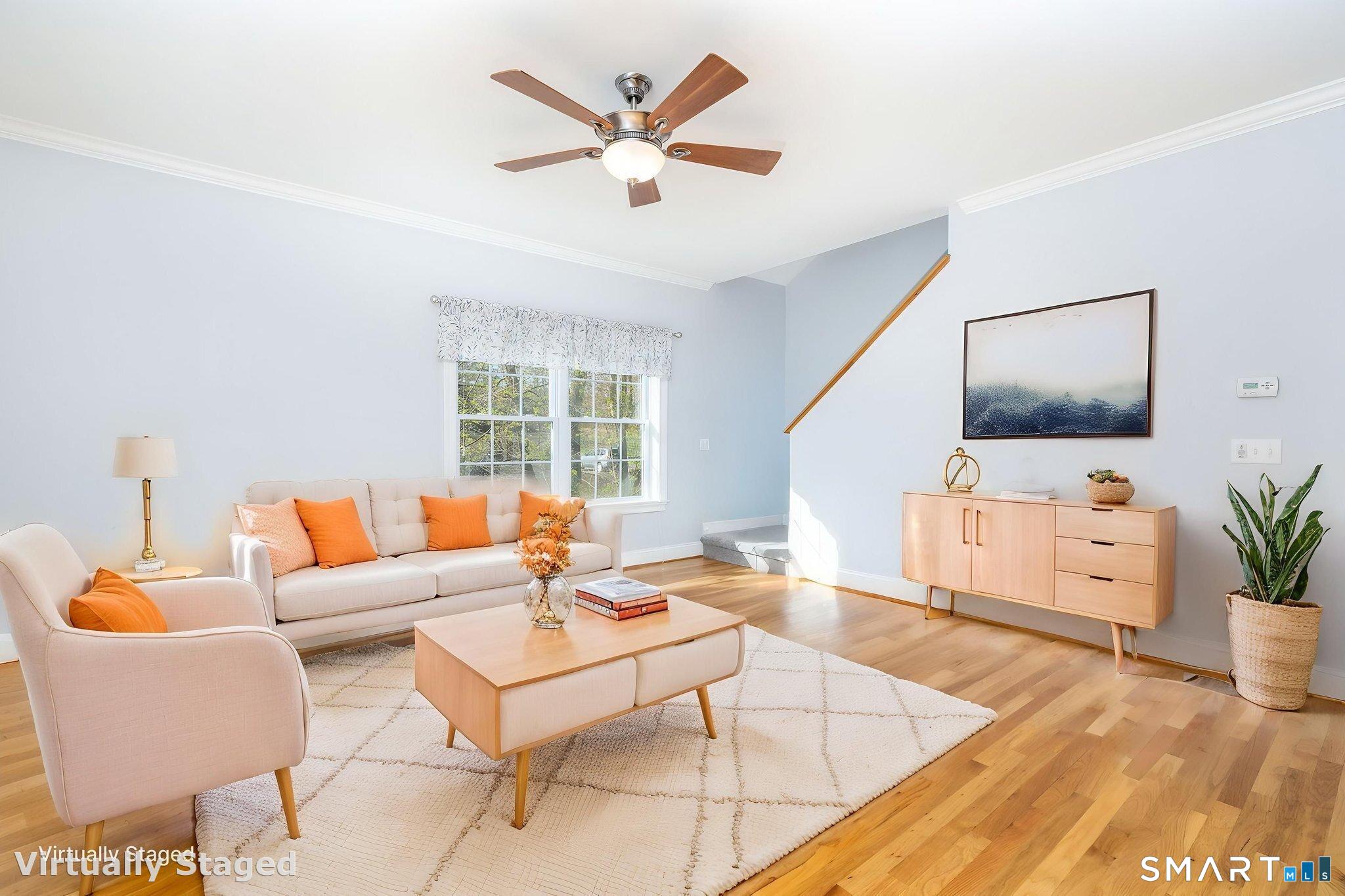 66 Kristyn Circle, Unit 66 Manchester, CT 06042 - Photo 4 of 26 a living room with furniture and a flat screen tv