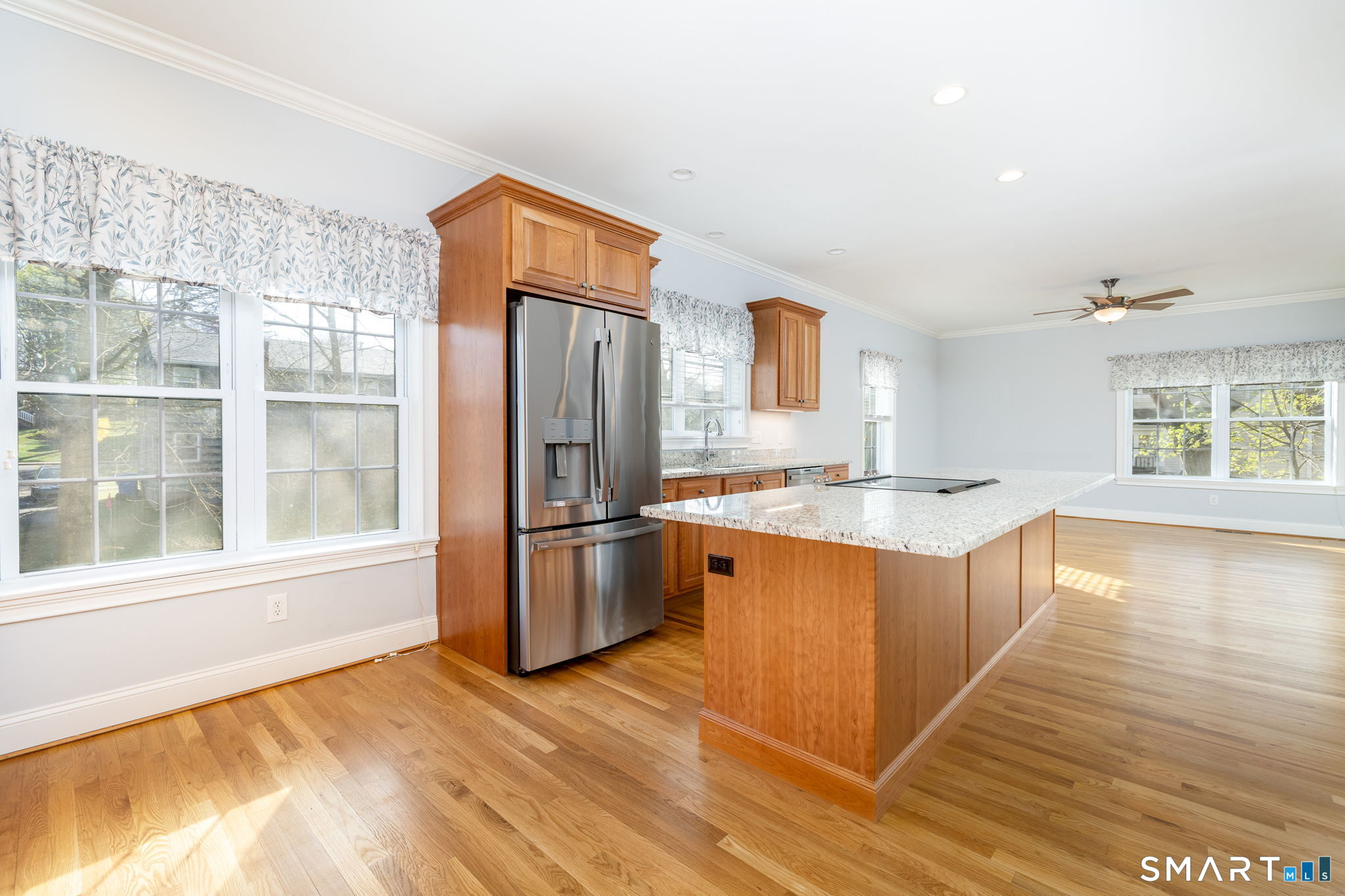 66 Kristyn Circle, Unit 66 Manchester, CT 06042 - Photo 6 of 26 a kitchen with stainless steel appliances granite countertop a refrigerator a sink dishwasher a stove with wooden cabinets and floors