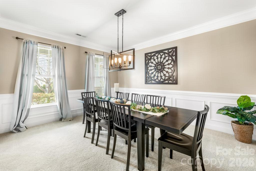 1007 Hamil Ridge Drive Waxhaw, NC 28173 - Photo 11 of 44 a view of a dining room with furniture window and outside view