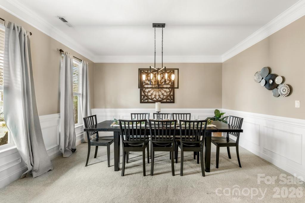 1007 Hamil Ridge Drive Waxhaw, NC 28173 - Photo 12 of 44 a view of a dining room with furniture window and outside view