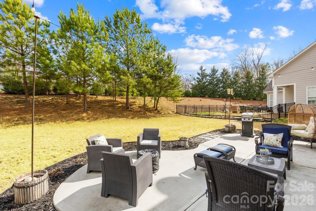 1007 Hamil Ridge Drive Waxhaw, NC 28173 - Photo 17 of 44 a view of a swimming pool with couches and lounge chairs