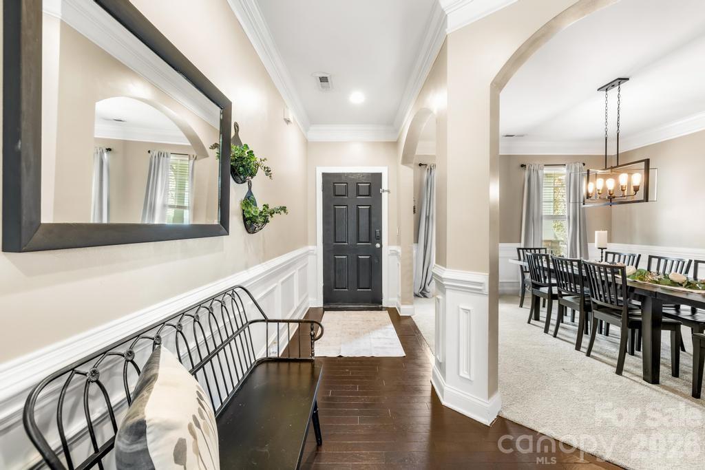 1007 Hamil Ridge Drive Waxhaw, NC 28173 - Photo 2 of 44 a view of a dining room with furniture window and wooden floor