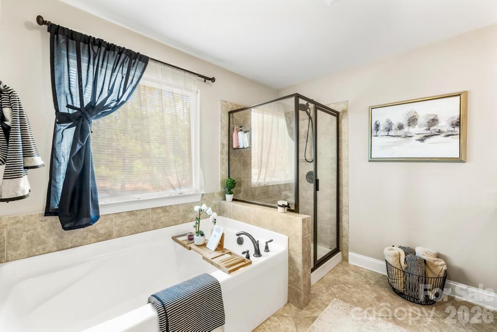 1007 Hamil Ridge Drive Waxhaw, NC 28173 - Photo 33 of 44 a spacious bedroom with a bed and a window