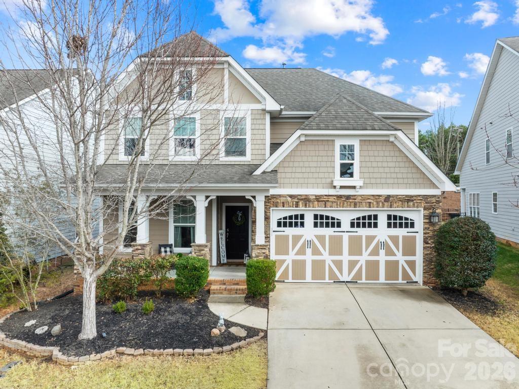 1007 Hamil Ridge Drive Waxhaw, NC 28173 - Photo 6 of 44 a front view of a house with a garden