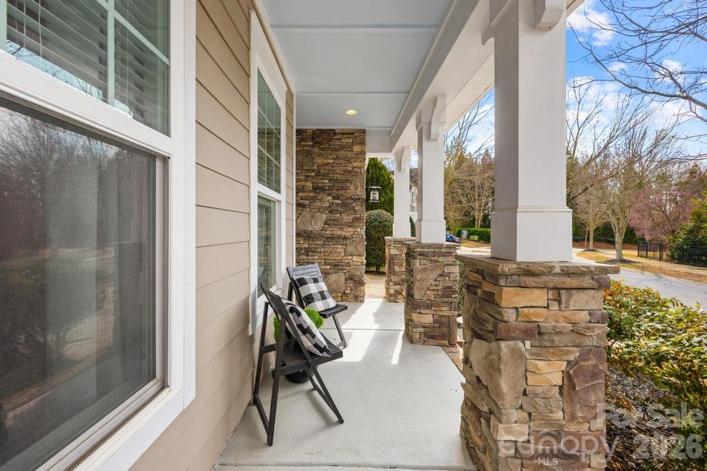 1007 Hamil Ridge Drive Waxhaw, NC 28173 - Photo 10 of 44 a balcony with furniture and a potted plant