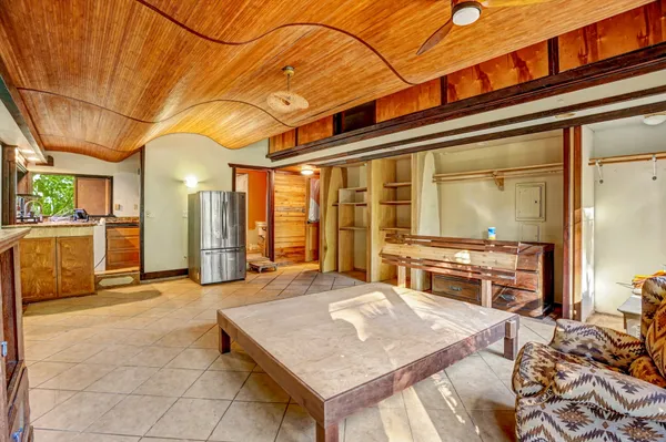 a view of a living room and kitchen