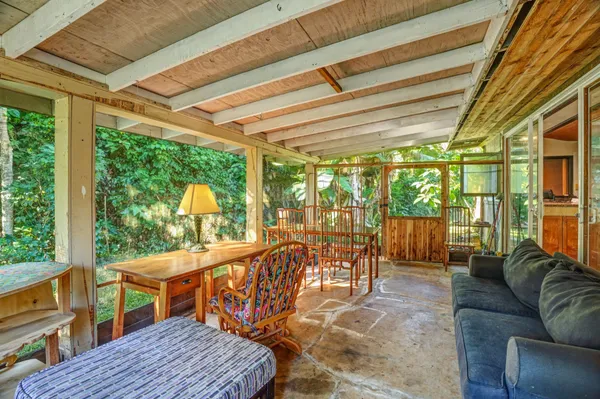 a view of a patio with a table chairs and a patio