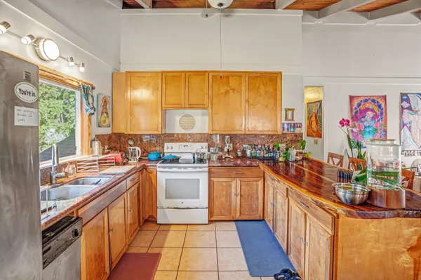 a kitchen with stainless steel appliances a sink and a stove