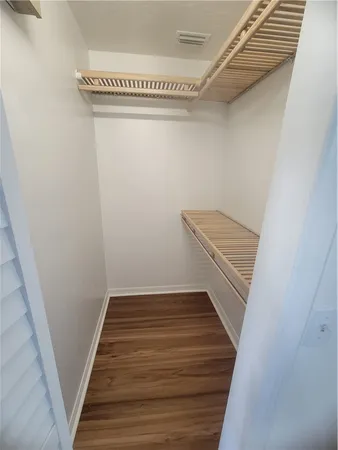 a view of wooden floor in an empty room
