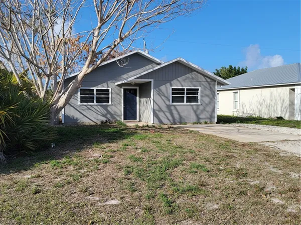 a house with trees in the background
