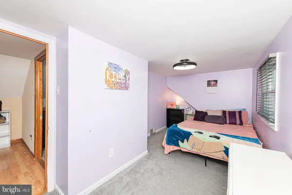 a bedroom with furniture and window