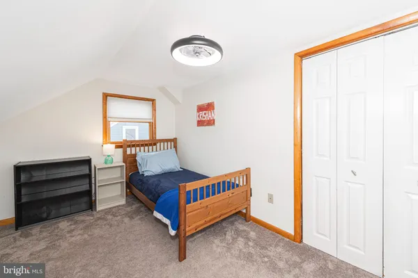 a bedroom with furniture and a window