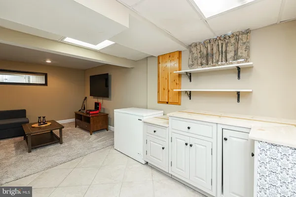 a kitchen with a cabinets and window