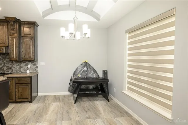 a view of a livingroom with furniture and staircase