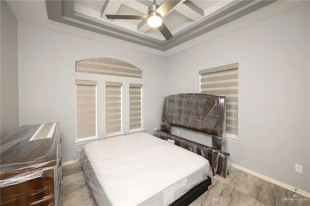 a bedroom with a bed and a couch