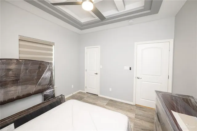 a bedroom with a bed and couch