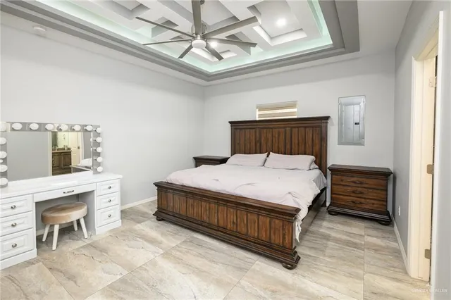 a bed room with a bed and a chandelier