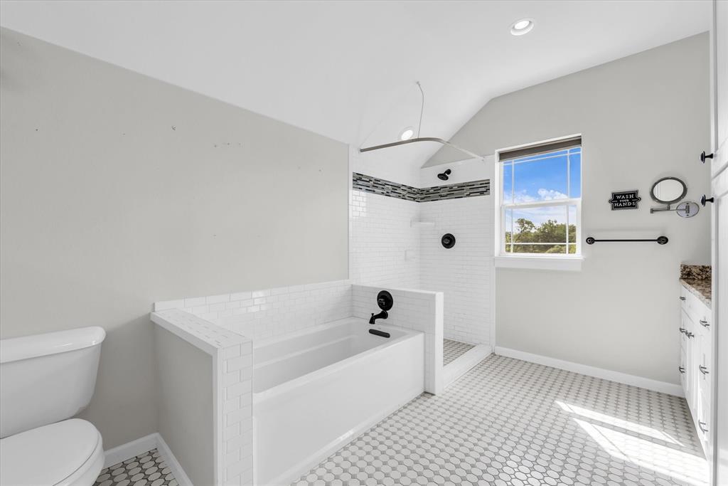 348 Barker Lane Waco, TX 76705 - Photo 19 of 39 a bathroom with a sink a toilet and shower