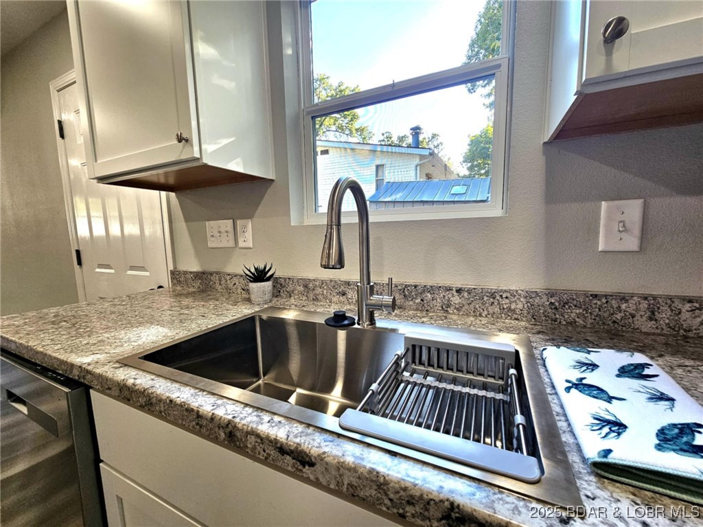 4861 University Lane Osage Beach, MO 65065 - Photo 5 of 31 Kitchen with stainless steel sink.
