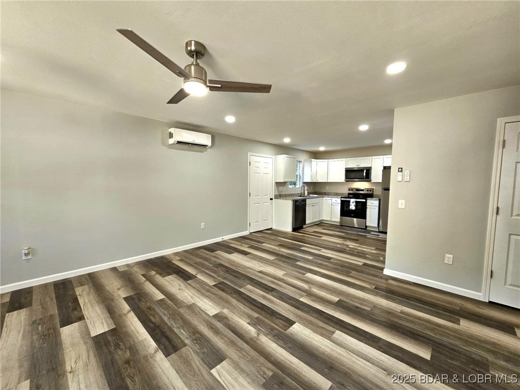 4861 University Lane Osage Beach, MO 65065 - Photo 6 of 31 Open living and kitchen area.