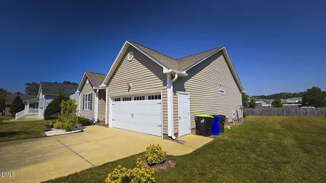 a view of a house with a backyard