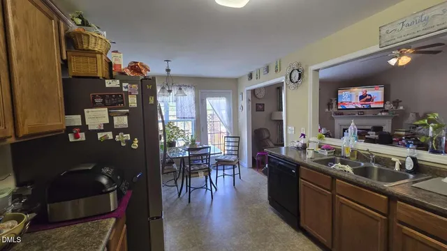 a kitchen view of a dining table and chairs