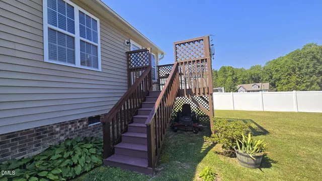 a view of a balcony with furniture