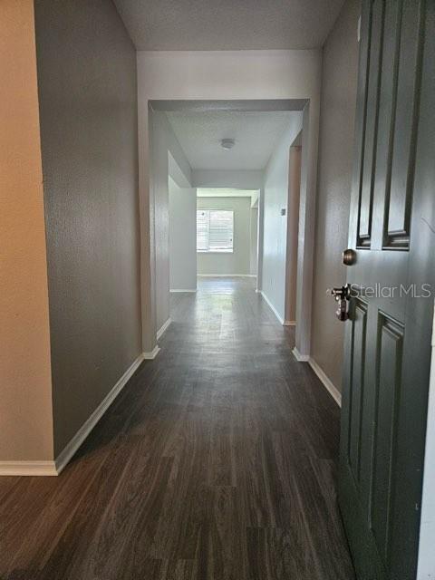 4432 Barbados Loop Clermont, FL 34711 - Photo 2 of 19 a view of a hallway with wooden floor