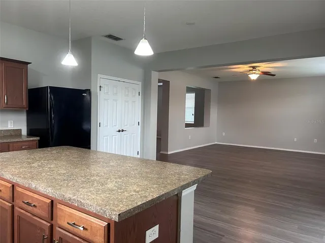 a kitchen with a sink and refrigerator