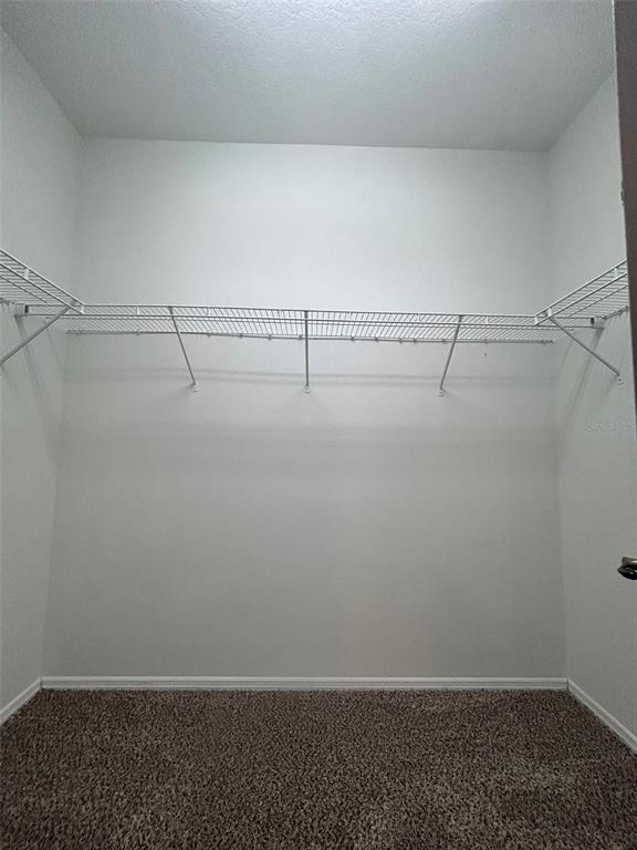 4432 Barbados Loop Clermont, FL 34711 - Photo 10 of 19 a view of a room with racks on the wall