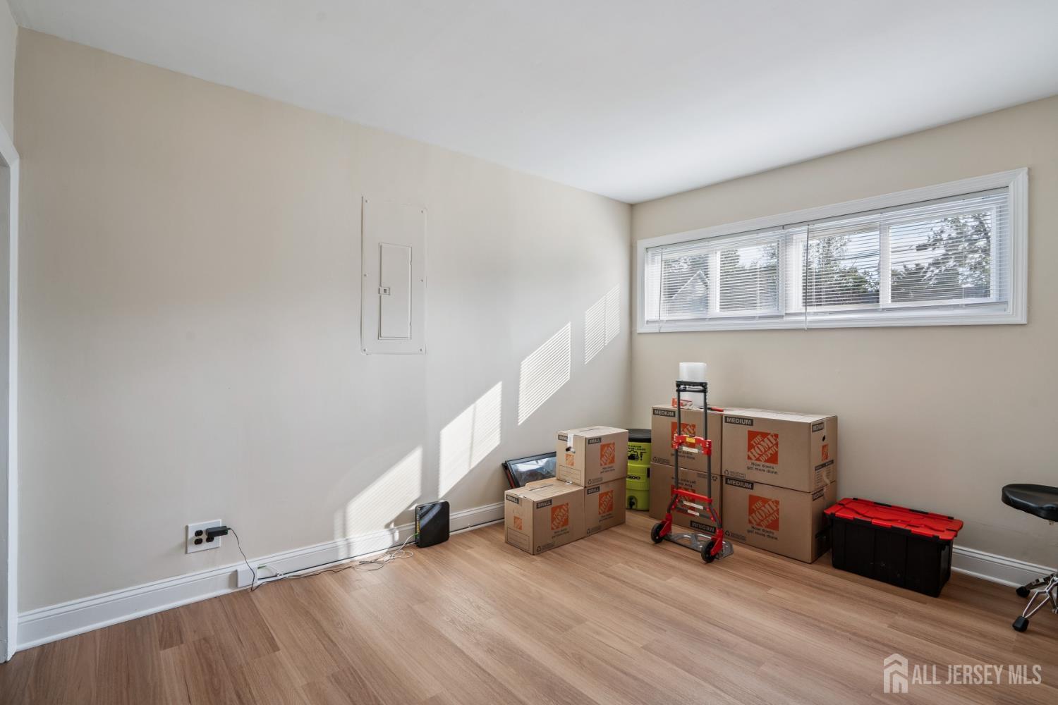 12 Brookville Road Edison, NJ 08817 - Photo 17 of 25 a view of a room with lots of stuff and hardwood floor