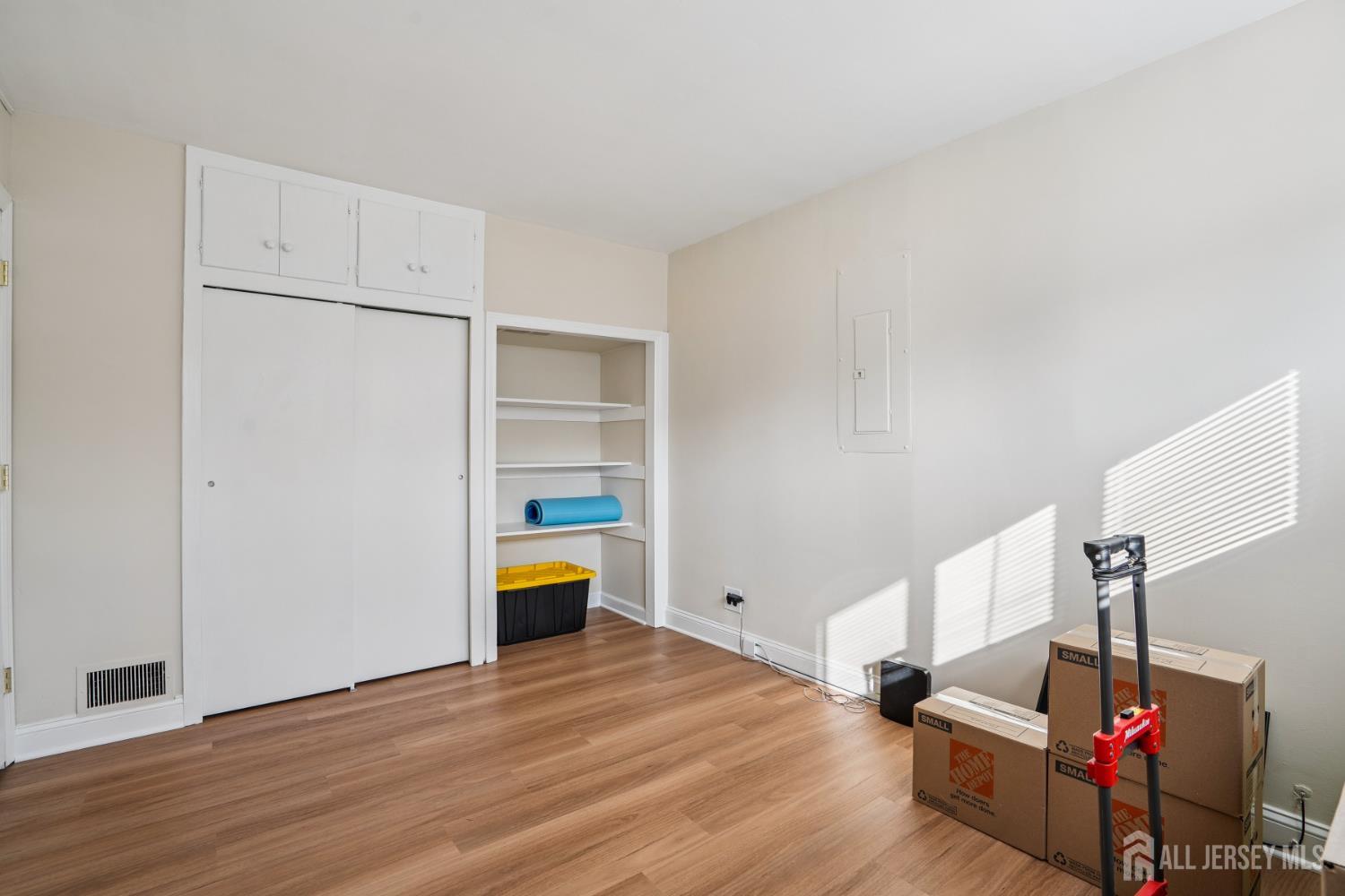 12 Brookville Road Edison, NJ 08817 - Photo 18 of 25 a view of hallway with stairs and wooden floor